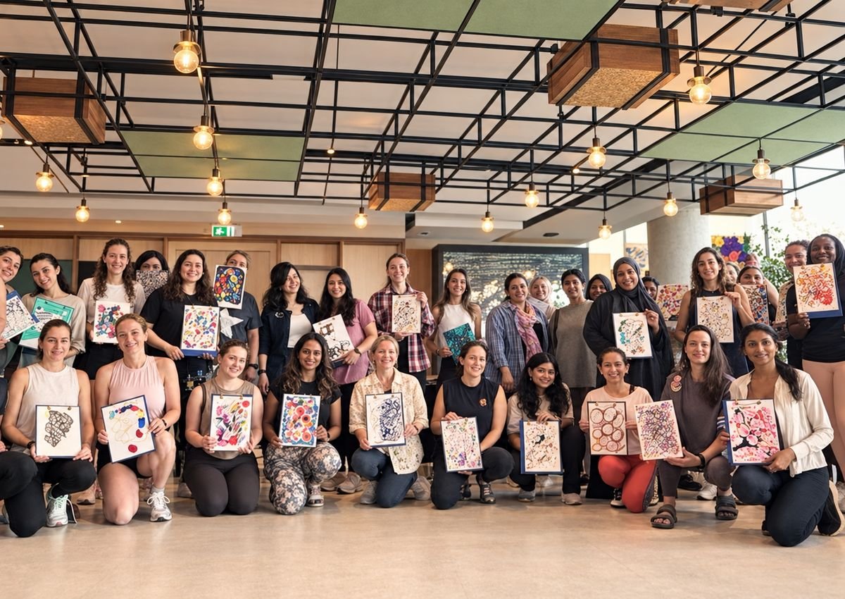 A group holding their finished artworks