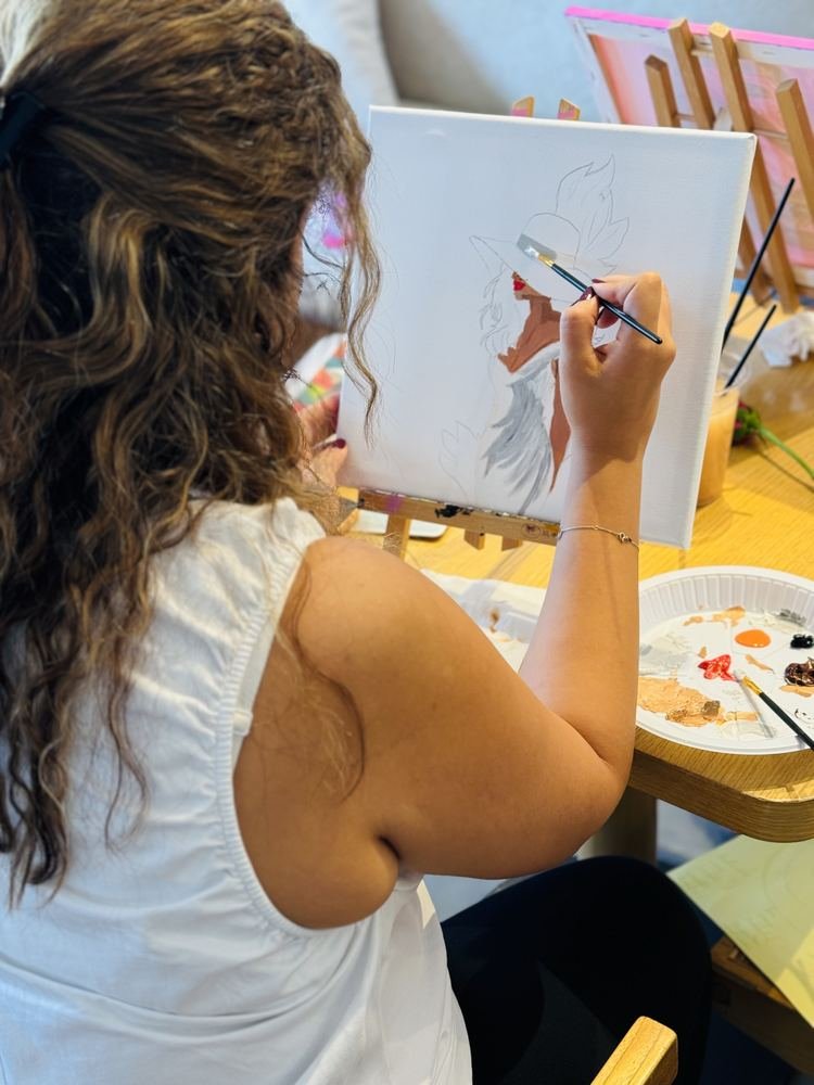 A guest painting a portrait