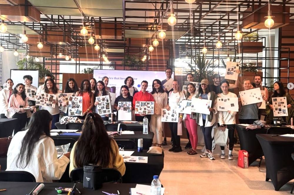A large group painting together at an event